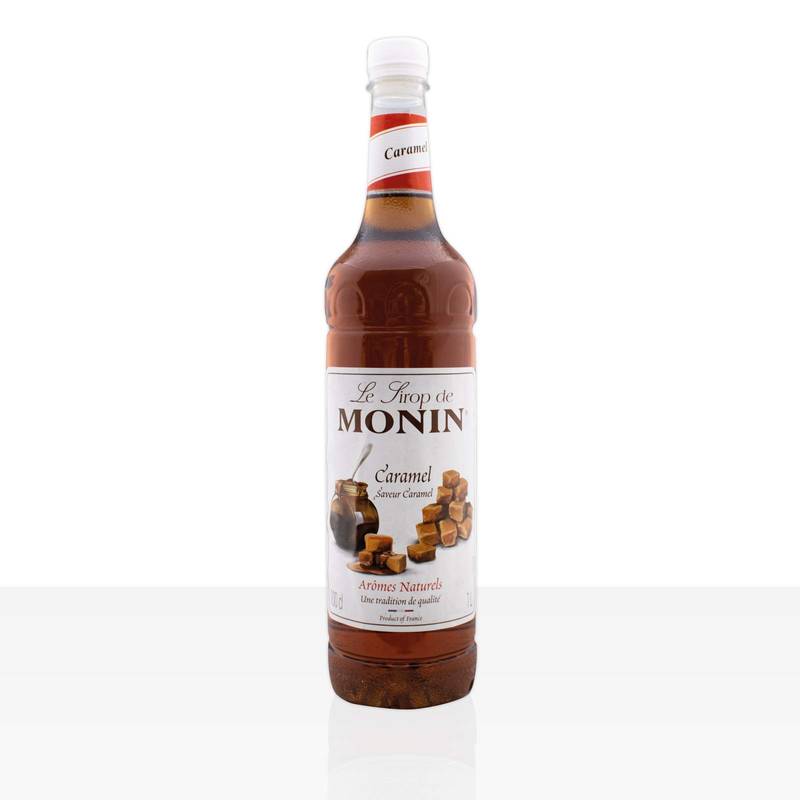 Bottle of Monin Caramel syrup on a white background